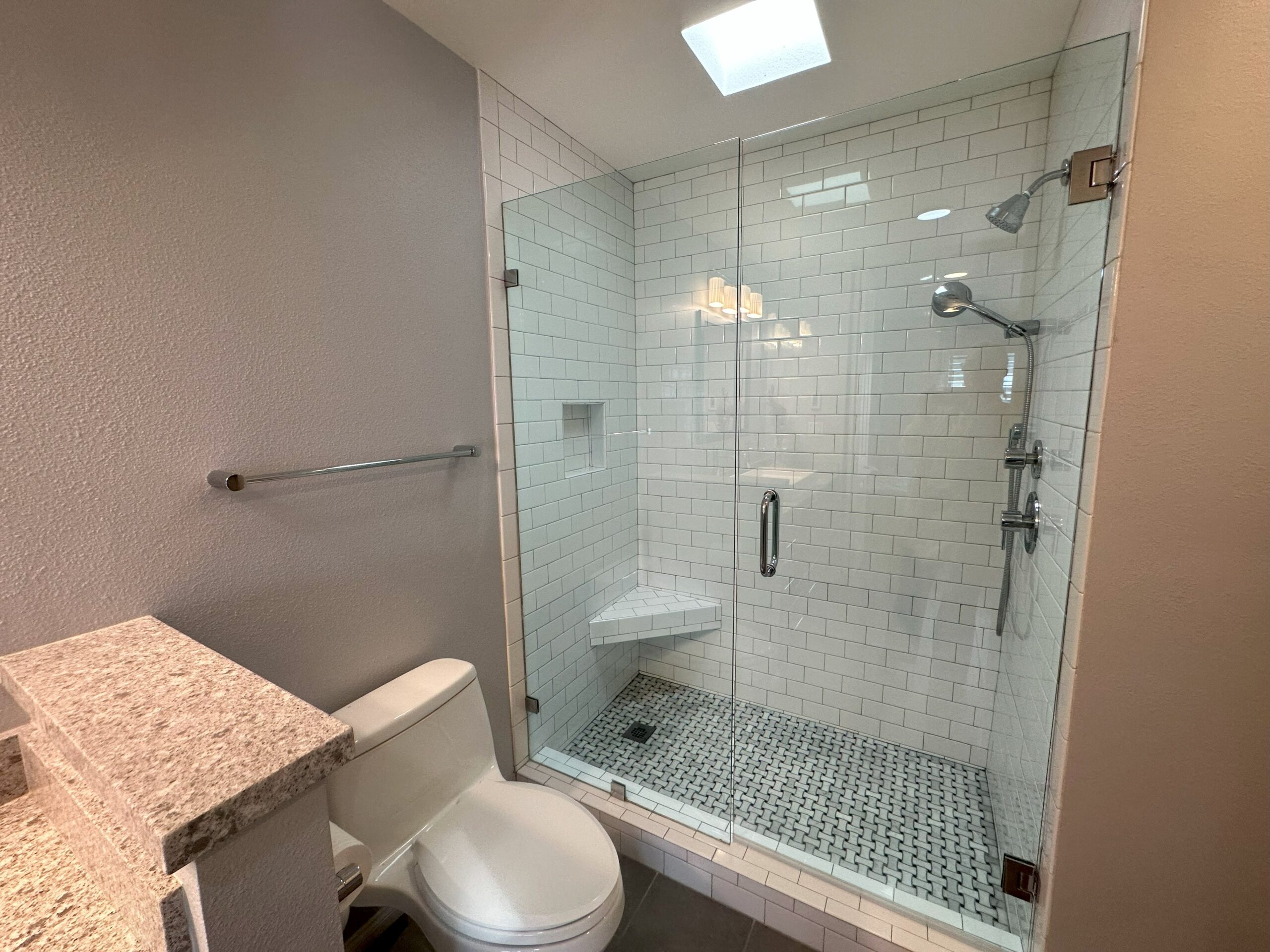 A bathroom with a toilet and shower in it