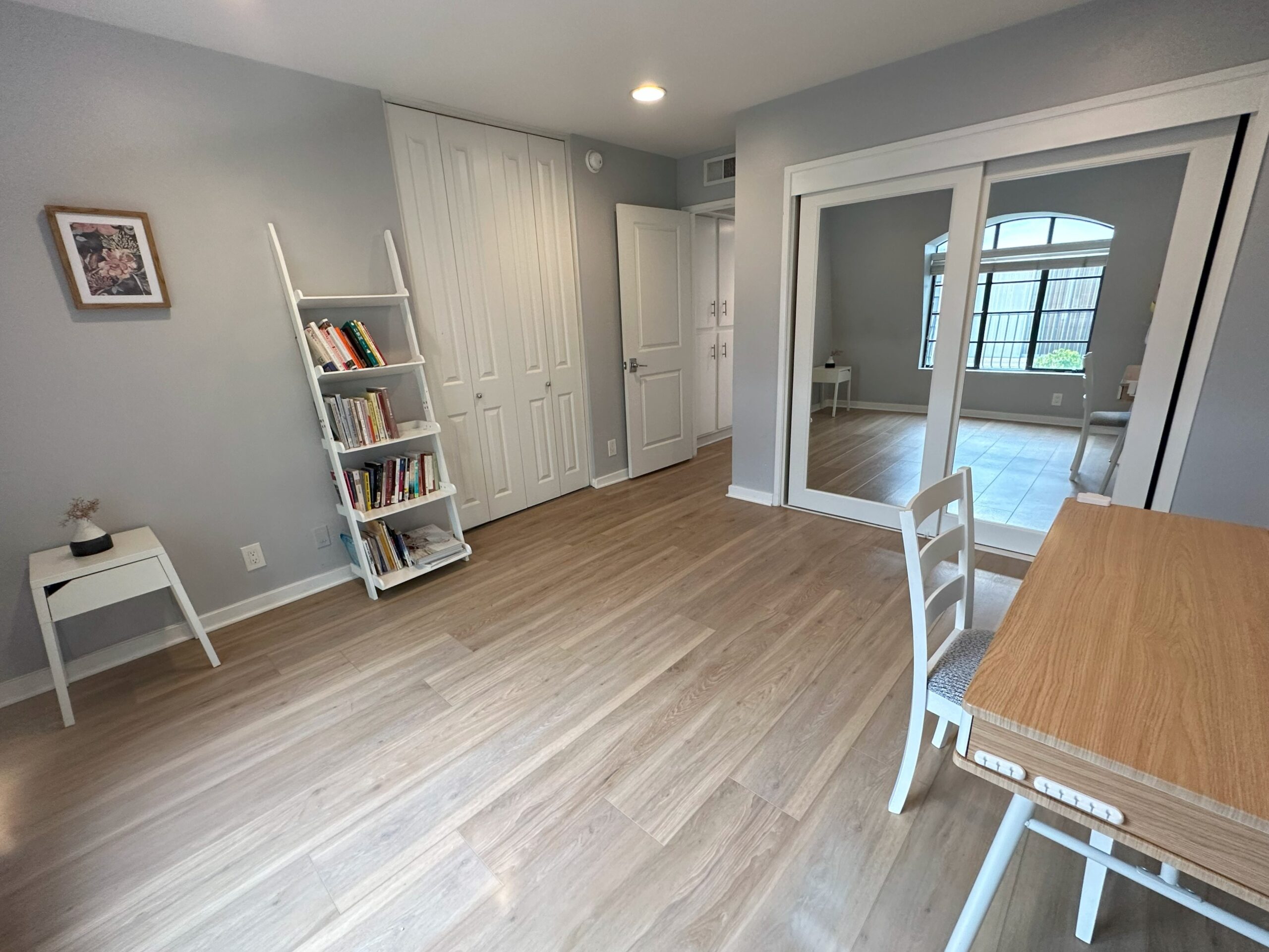 A room with a table and chairs in it