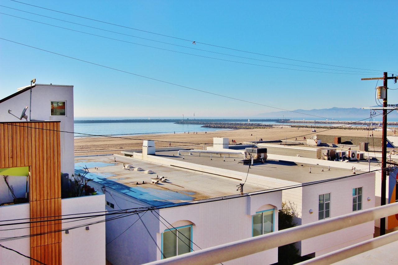 A view of the ocean from an apartment building.