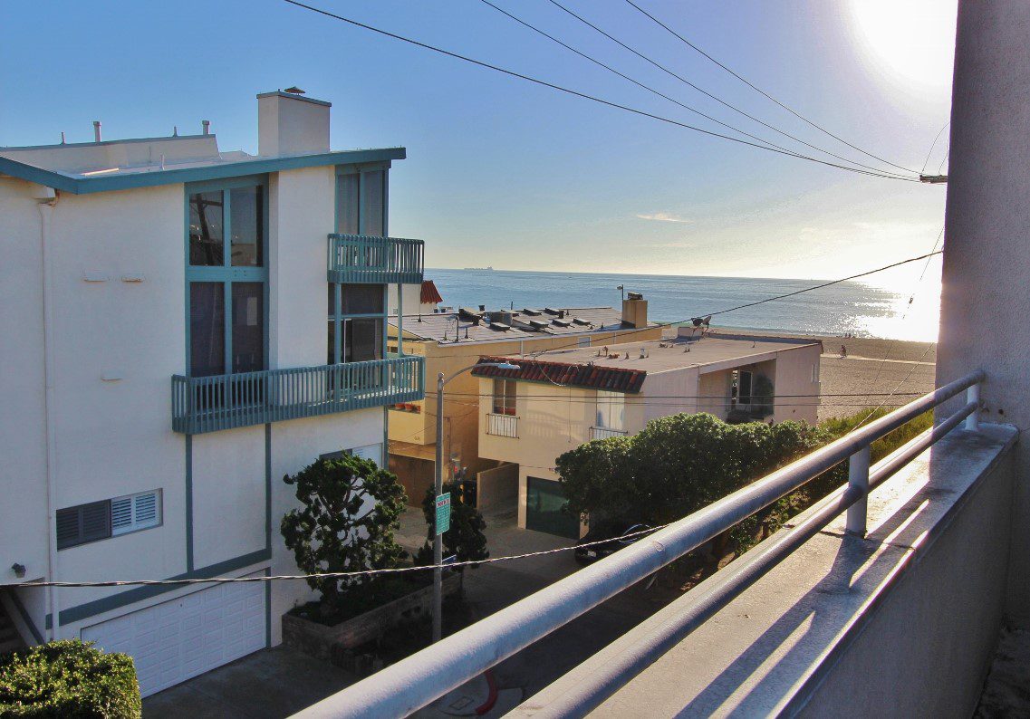 A view of the ocean from an apartment building.