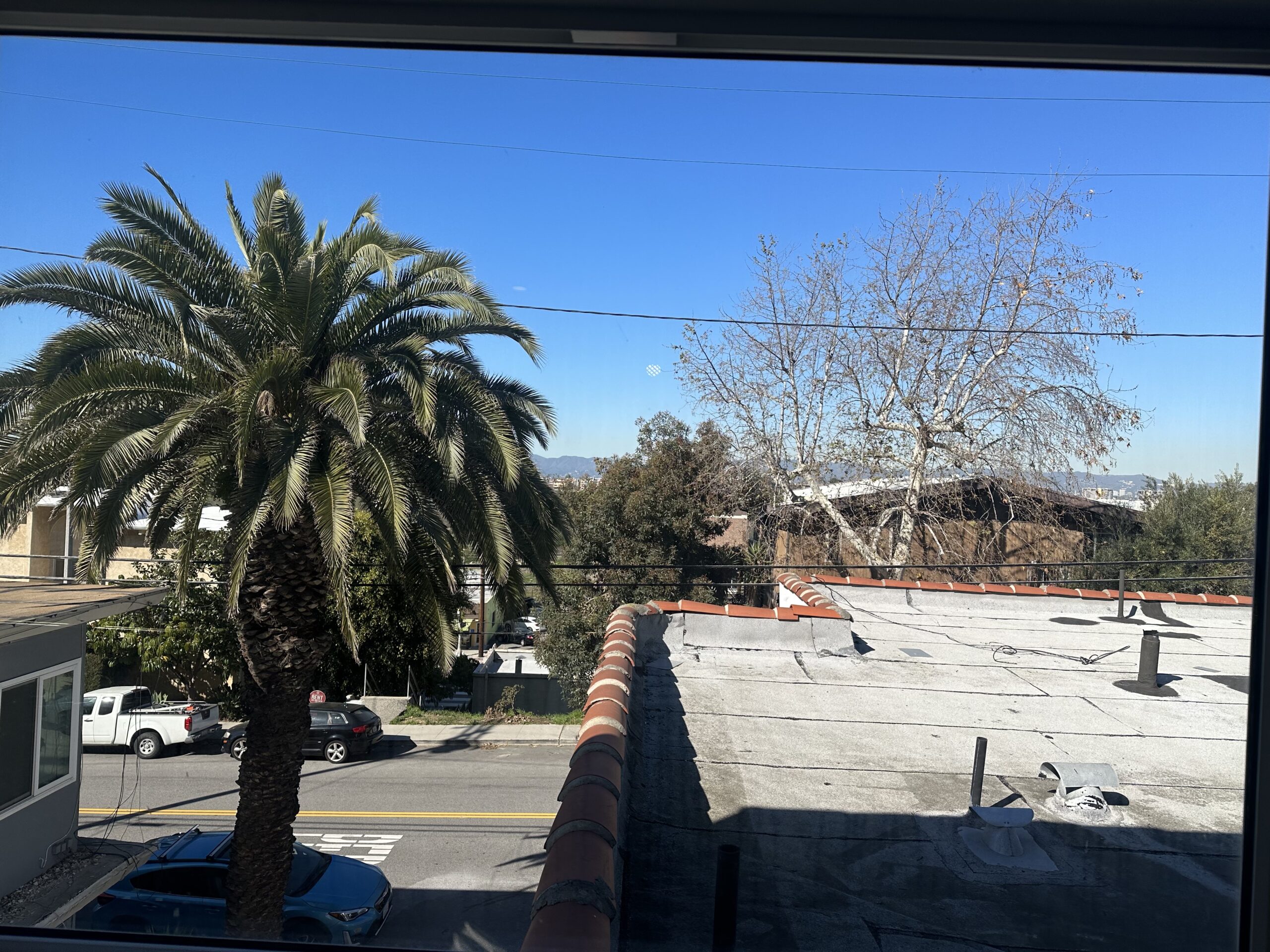 A view of the street from an apartment window.